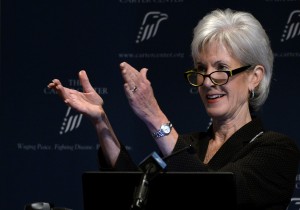 Department of Health and Human Services Secretary Kathleen Sebelius applauds as she announces easier access to mental health care during an address to former First Lady Rosalynn Carter's 29th annual mental health policy symposium at the Carter Center on Friday, Nov. 8, 2013, in Atlanta. [CREDIT: David Tulis, for The Associated Press]