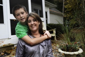 In this photo, Jill Morin, right, poses for photos with her son Kyle at their home in Raleigh, N.C.  Morin suffers from a serious heart condition and suffered a cardiac arrest in 2009. [CREDIT: Gerry Broome, for The Associated Press]