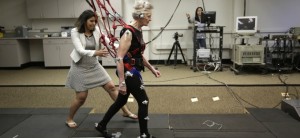 University of Illinois-Chicago physical therapy assistant professor Tanvi Bhatt, left, walks alongside Mary Kaye, 81 as she demonstrates a treadmill balance session. Kaye, who is supported by a safety harness, walks on a lab-built walkway that causes people to unexpectedly trip and can teach them quickly how to catch themselves and avoid falling. Falls in the elderly cost $30 billion yearly to treat and can send them spiraling into poor health and disability. Clive Pai, a UIC physical therapy professor, who came up with the idea calls it "a vaccine against falls" and says his research shows that older people's brains can learn and adapt much more quickly than previously thought. (AP Photo/M. Spencer Green)