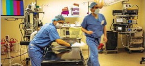 Staff members prepare an operating area at the Massachusetts Avenue Surgery Center; about 4,000 procedures are performed annually at the center, according to its executive director.