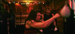Trainer Alicia Napolean shows Kyle Van Fleet, an investment banker, how to work a speed bag at the Overthrow New York gym, in New York, July 16, 2015. Two new gyms in Manhattan offer boxing as a novel, non-contact workout, and even at Brooklyn’s old-school Gleason’s Gym, most people never take a punch. (Bon Duke/The New York Times)