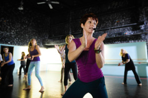 Kelly Atkins leads her class through dance moves during her class Tuesday, February 16 at Soul Studios. Atkins has melded years of fitness training with her studies of the brain into a mind-body-spirit dance exercise she calls Kai.   STAFF PHOTO / RACHEL S. O'HARA