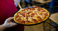 Some of the world's biggest restaurant chains, including pizza makers, have taken major steps to voluntarily limit the use of antibiotics in their supply chain.