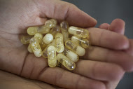 Katerina Scheider, founder of Ritual, which makes so called "clean label" vitamins,holds prototype pills at the new vitamin company's office is West Hollywood, Calif.